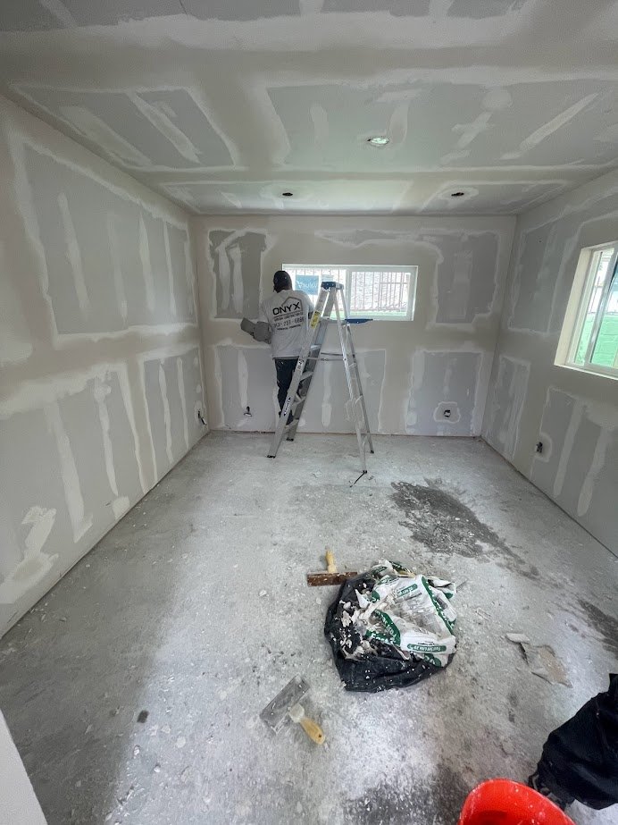 Bedroom drywall installation by a Los Angeles contractor.
