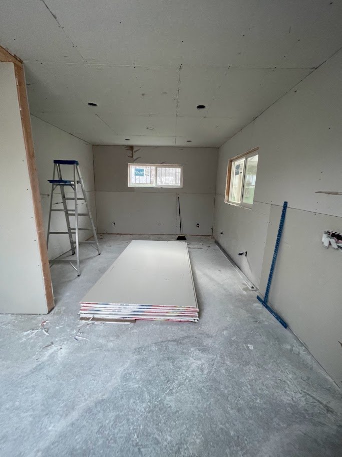 ADU drywall installation during Los Angeles interior construction.