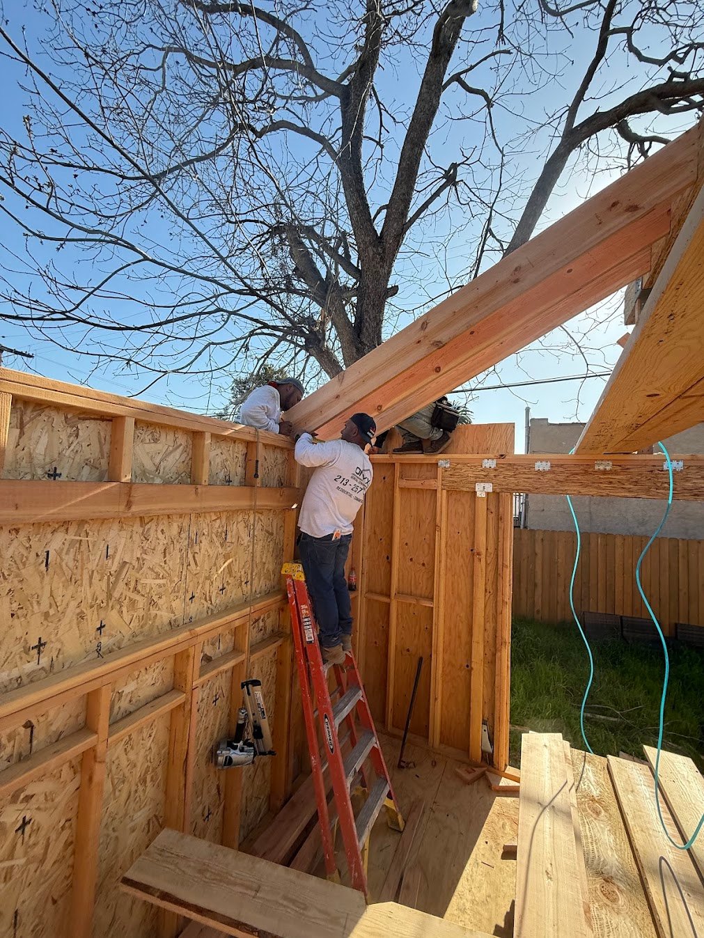 LVL beam installation for a vaulted ceiling room addition in Los Angeles.