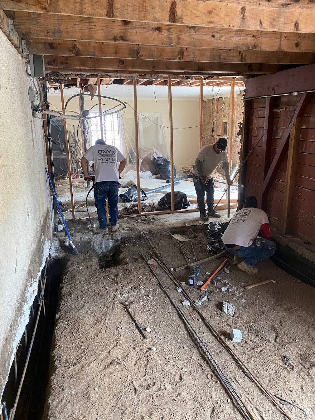 Interior demolition for foundation preparation in a Los Angeles residence.