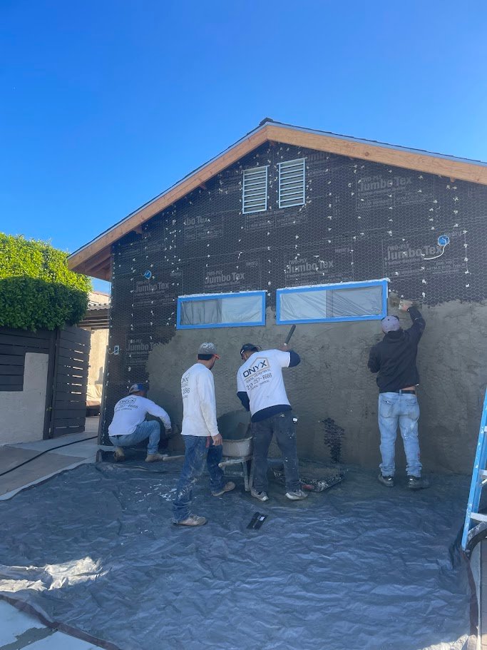 ADU stucco brown coat application in Los Angeles.