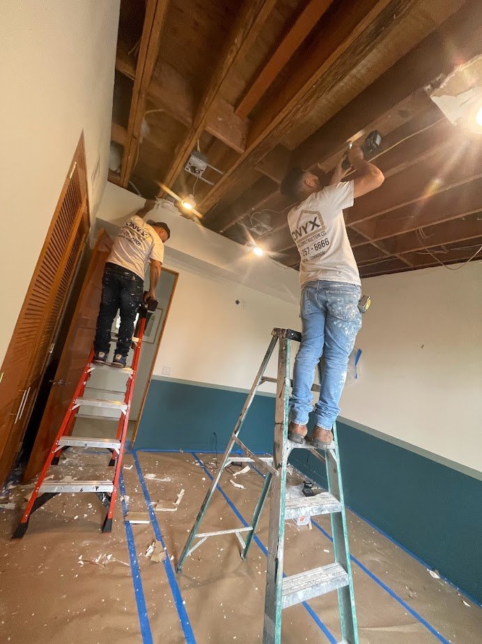 Ceiling rough electrical work during a Los Angeles remodel.