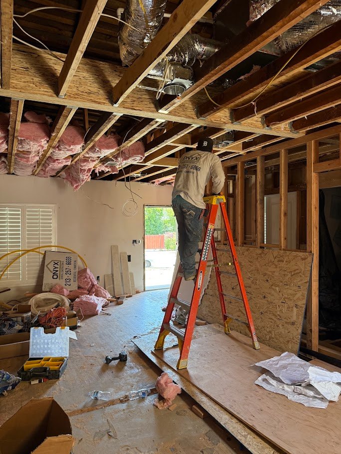 Ceiling demolition with electrical and HVAC rough-in work in Los Angeles.